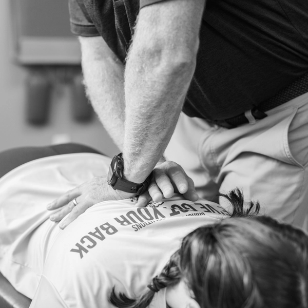 Chiropractor Framingham MA Christopher Hauck Adjusting Back